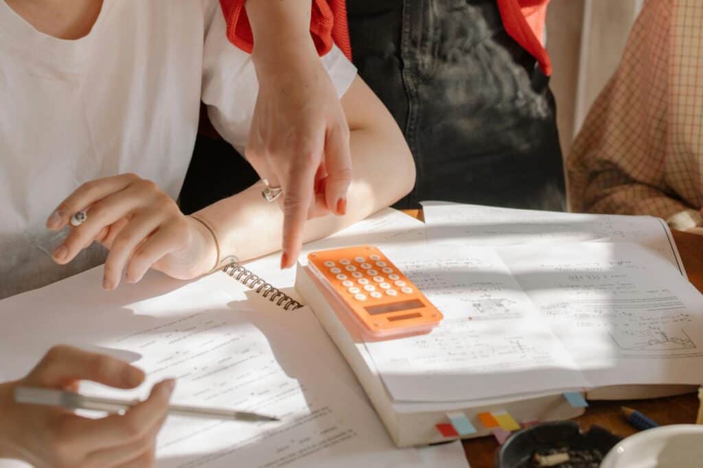 Cropped image of college students studying together