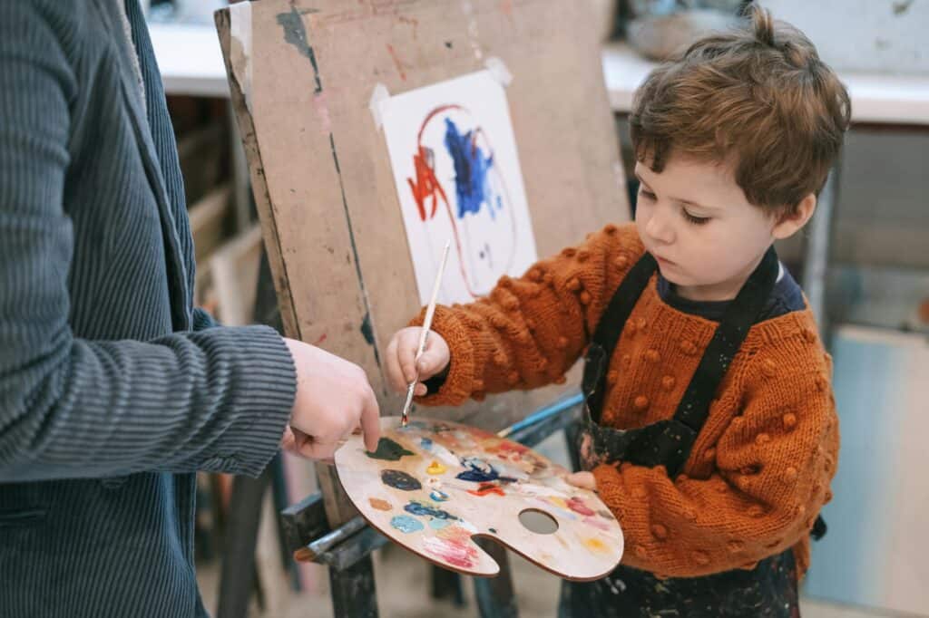 A male young student in an art class