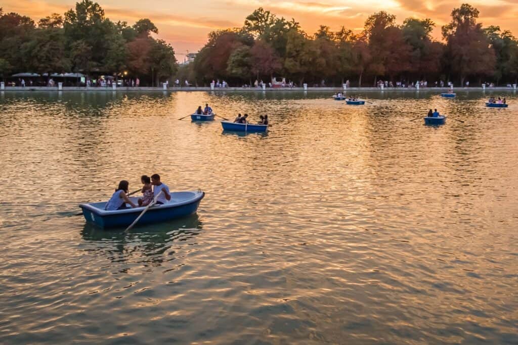 People on boats in the park's lake